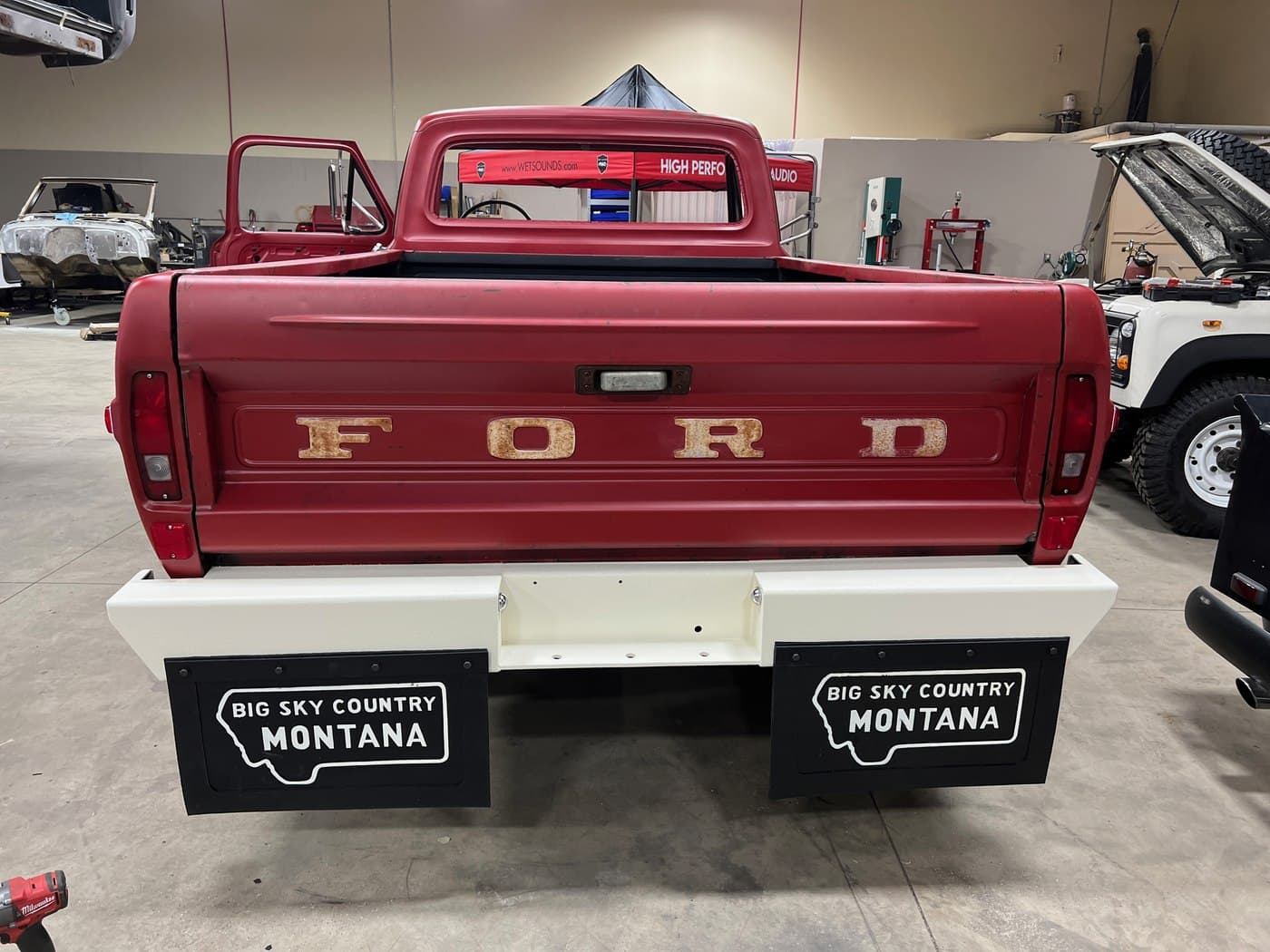 NEW BUMPER — REAR